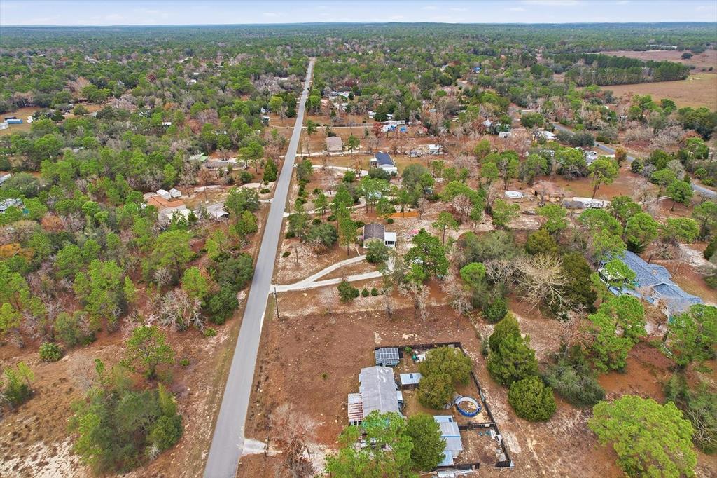 7305 South Threshold Point Homosassa, FL 34446 - Photo 45 of 46 an aerial view of residential houses with outdoor space