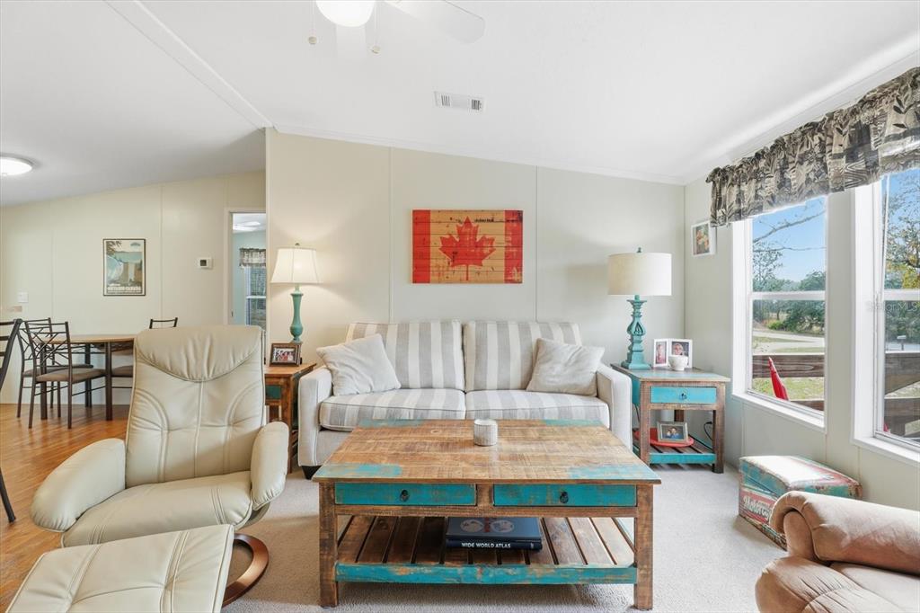 7305 South Threshold Point Homosassa, FL 34446 - Photo 5 of 46 a living room with furniture and a large window