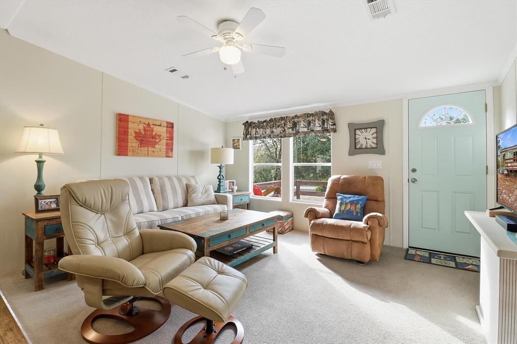 7305 South Threshold Point Homosassa, FL 34446 - Photo 6 of 46 a living room with furniture or couch and a window