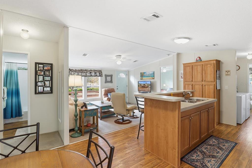 7305 South Threshold Point Homosassa, FL 34446 - Photo 9 of 46 a kitchen with stainless steel appliances granite countertop a stove refrigerator and cabinets