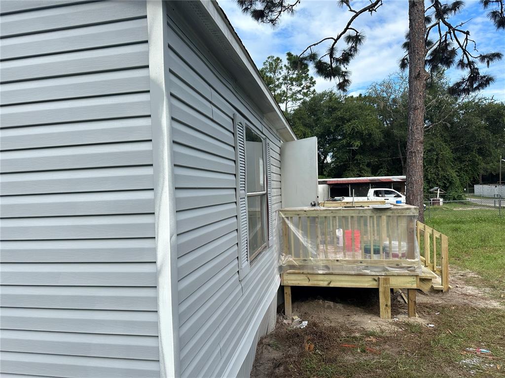 a view of barbeque area with seating area