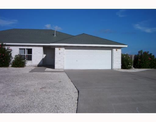 15346 Cruiser Street Corpus Christi, TX 78418 - Photo 1 of 7 a front view of a house with a yard