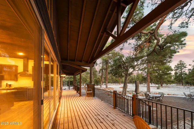 an aerial view of house with yard and mountain view in back