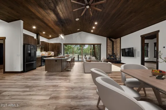 a view of balcony with chairs and wooden fence