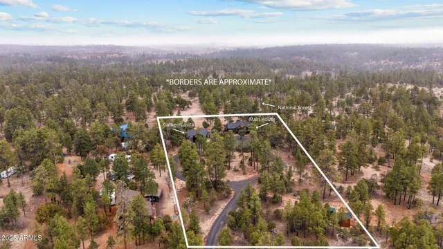 a view of a house with a yard siting area and garden