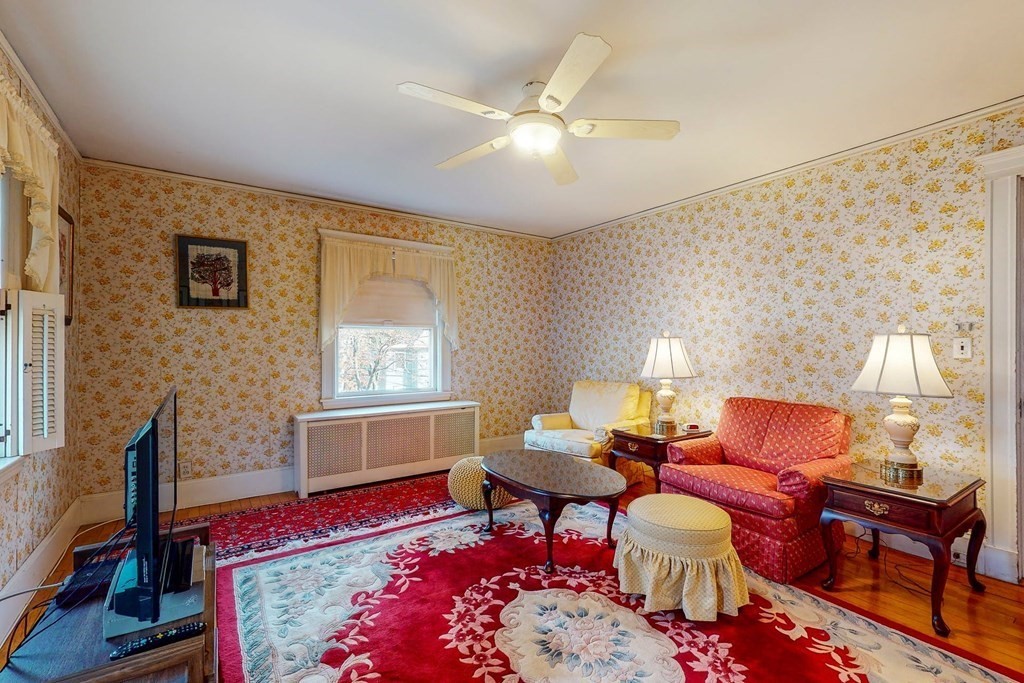 246 Clark Road Brookline, MA 02445 - Photo 14 of 18 a living room with furniture and a flat screen tv