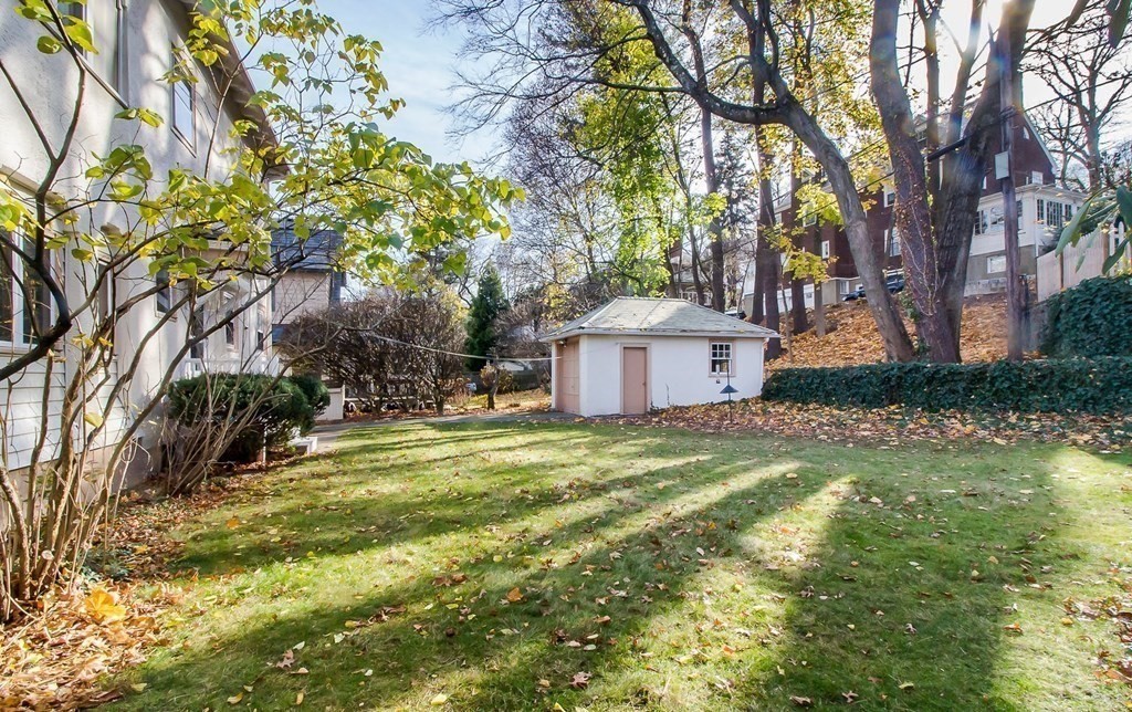 246 Clark Road Brookline, MA 02445 - Photo 17 of 18 a view of a house with a yard and sitting area