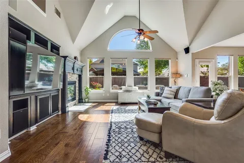 a living room with furniture or kitchen and a chandelier
