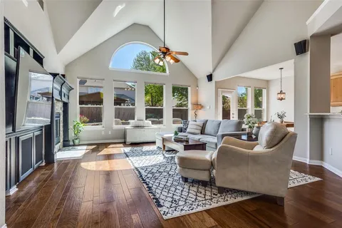 a living room with furniture fireplace and flat screen tv