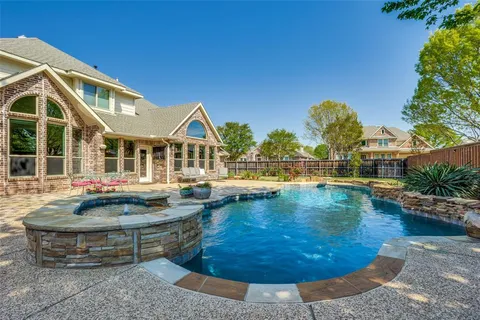 a view of a swimming pool with lounge chair