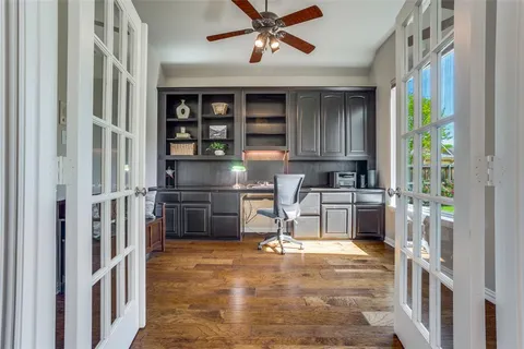 a kitchen with stainless steel appliances granite countertop a refrigerator and a stove