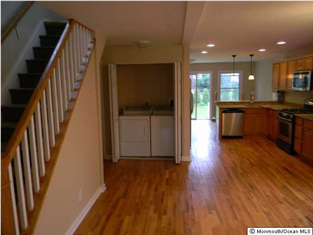 513 Couse Road Neptune Township, NJ 07753 - Photo 3 of 3 an open kitchen with wooden floor and electronic appliances