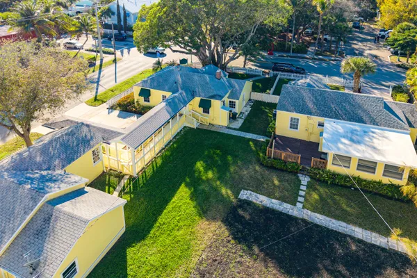 an aerial view of residential houses with outdoor space