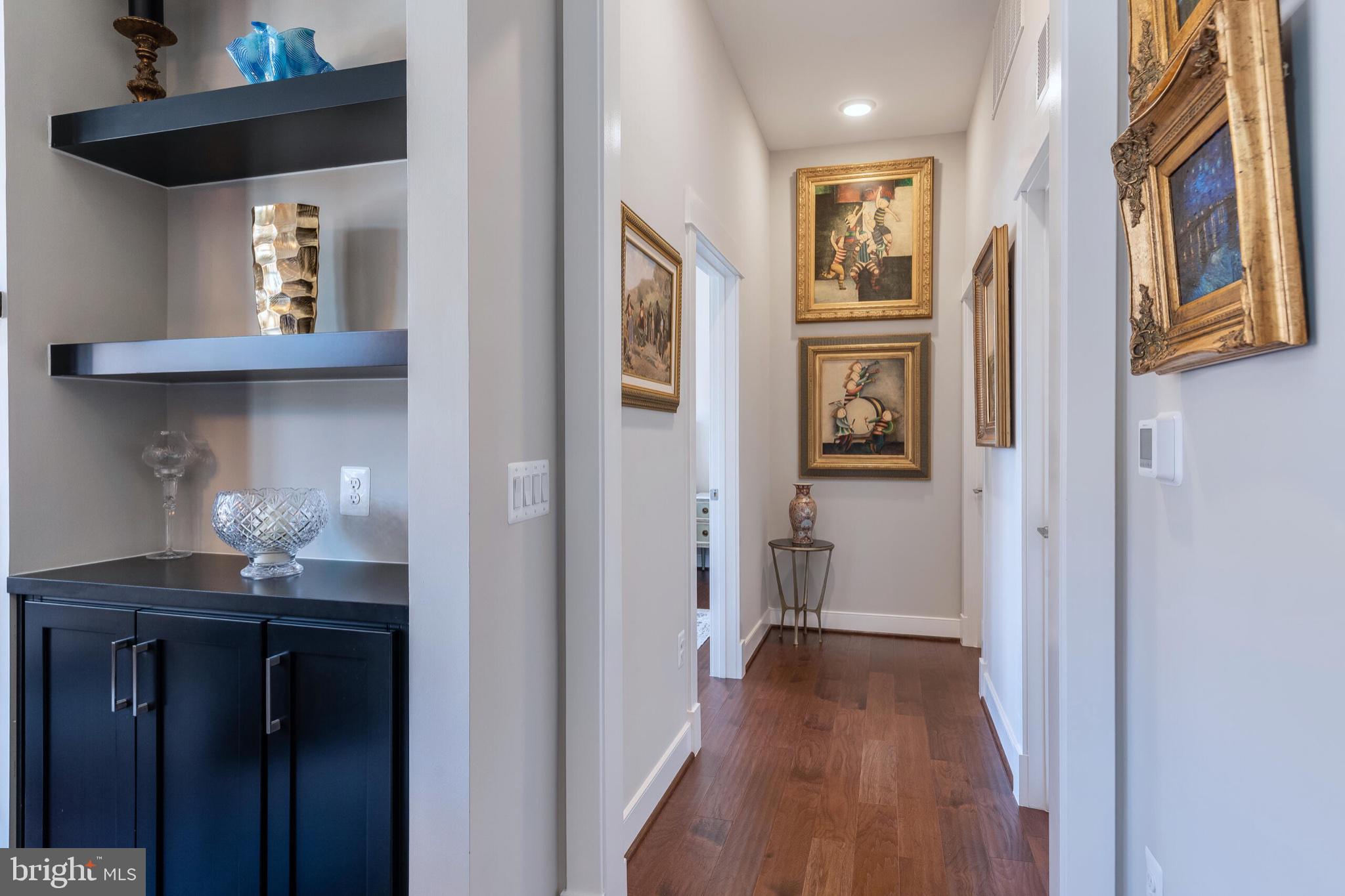 2 Stationmaster Street Southeast, Unit 202 Leesburg, VA 20175 - Photo 15 of 29 a view of a hallway with wooden floor and cabinet