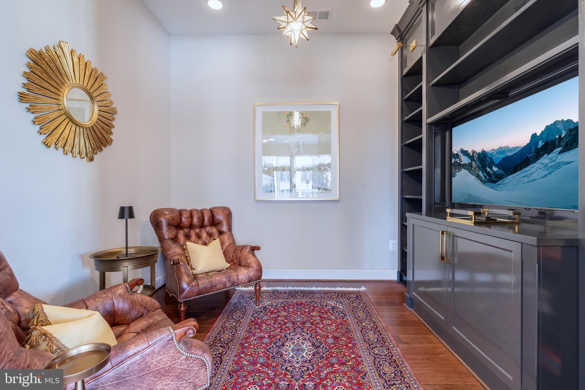 2 Stationmaster Street Southeast, Unit 202 Leesburg, VA 20175 - Photo 17 of 29 a living room with furniture and a rug