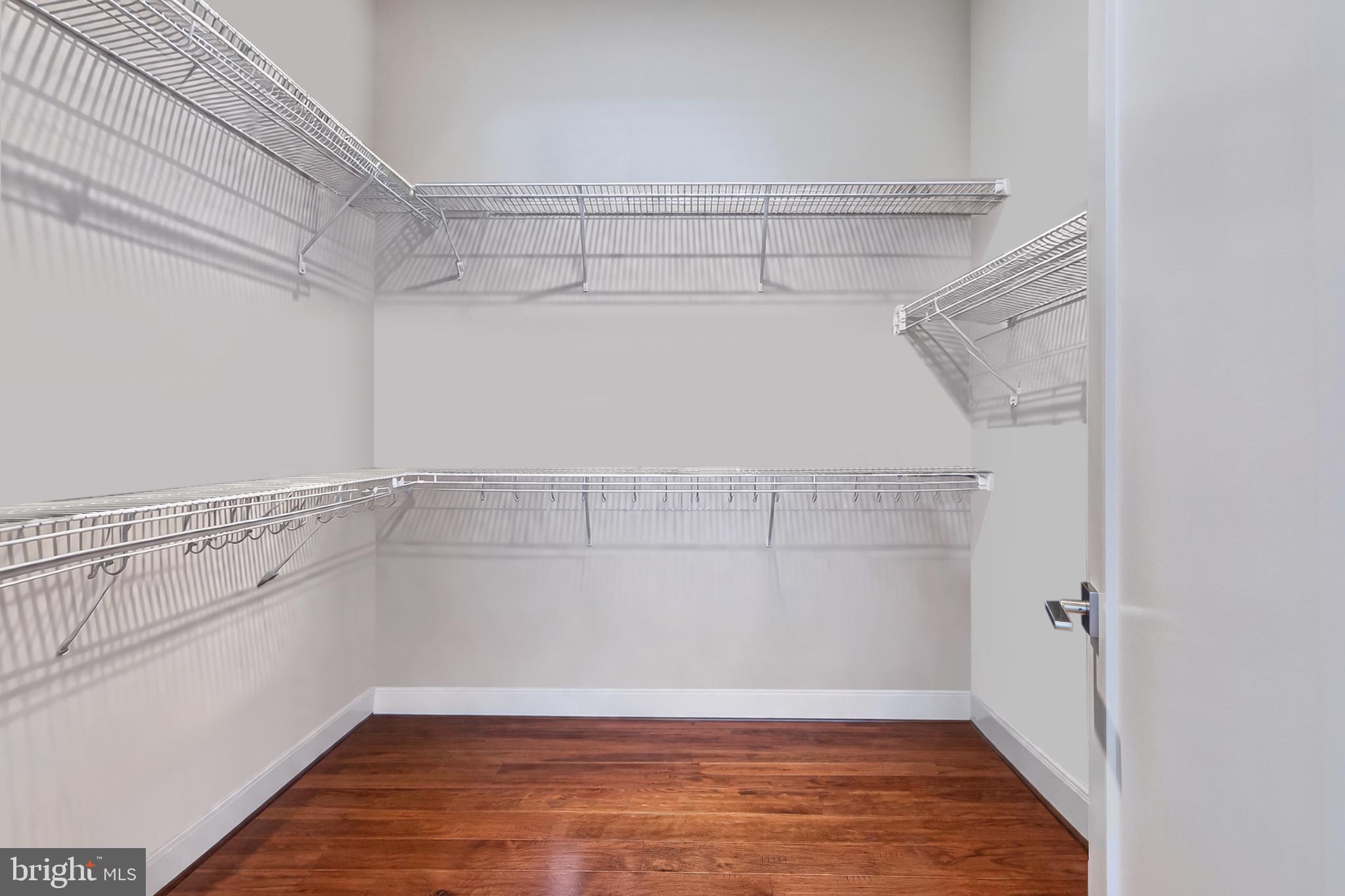 2 Stationmaster Street Southeast, Unit 202 Leesburg, VA 20175 - Photo 22 of 29 a view of a room with racks on the wall
