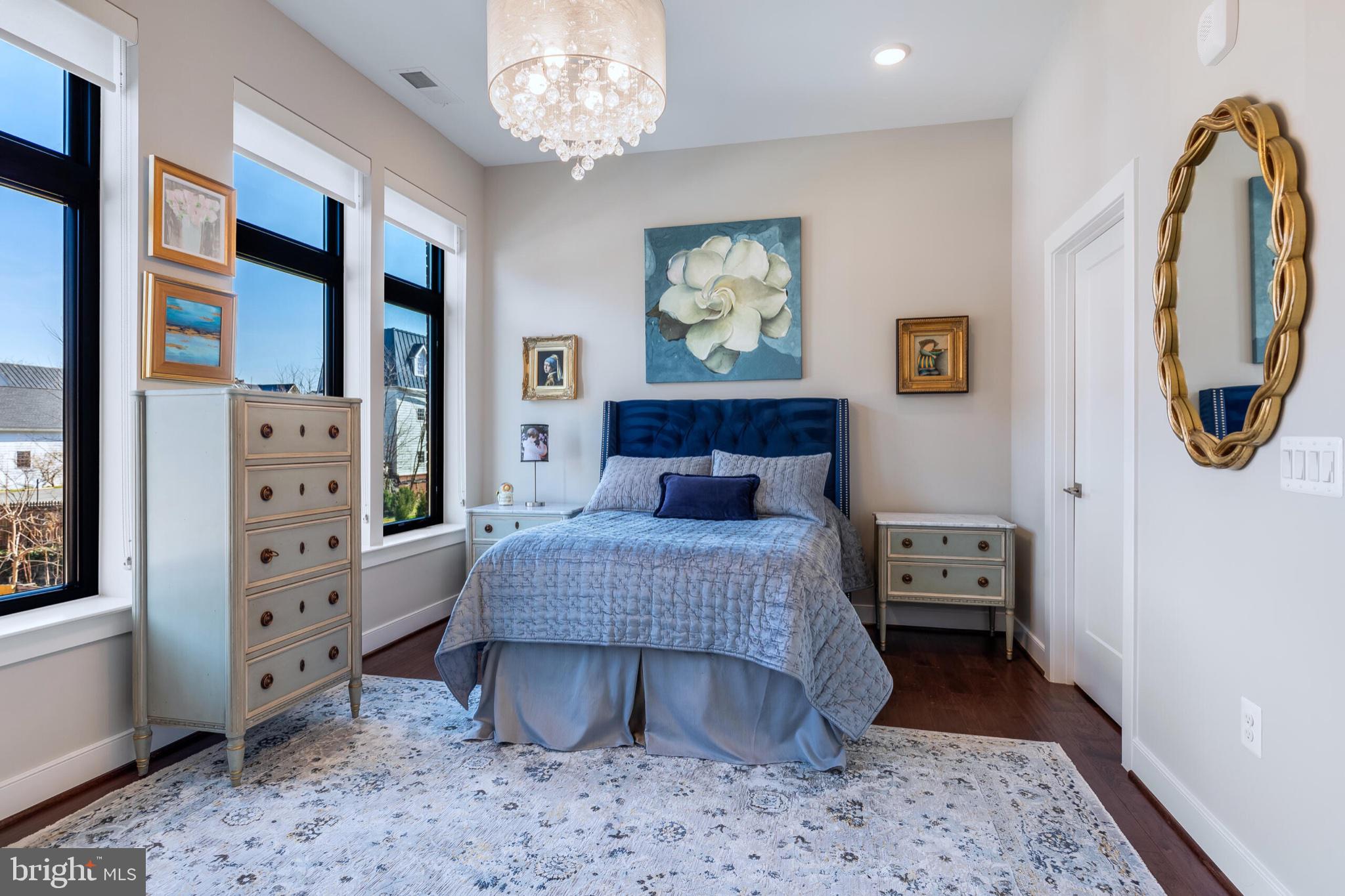 2 Stationmaster Street Southeast, Unit 202 Leesburg, VA 20175 - Photo 24 of 29 a bed room with a bed and a mirror