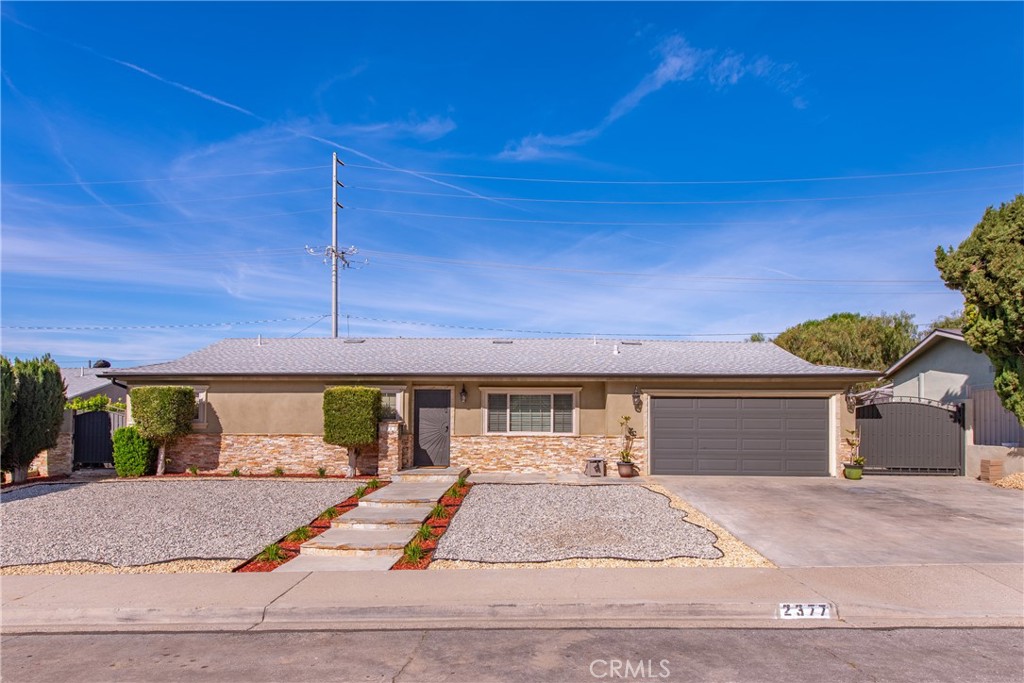 2377 Ralston Street Simi Valley, CA 93063 - Photo 1 of 1 a view of a house with a yard and a garage