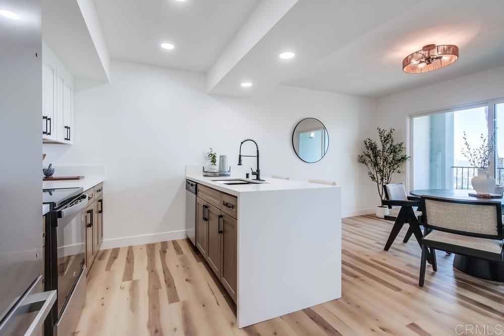 3606 Vista Rey, Unit 37 Oceanside, CA 92057 - Photo 9 of 45 a kitchen with a sink appliances and cabinets