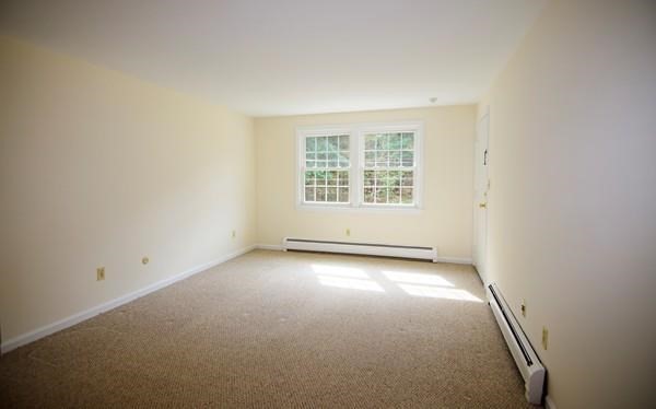 180 Tyngsboro Road, Unit 55D Chelmsford, MA 01863 - Photo 18 of 20 an empty room with a empty space and windows