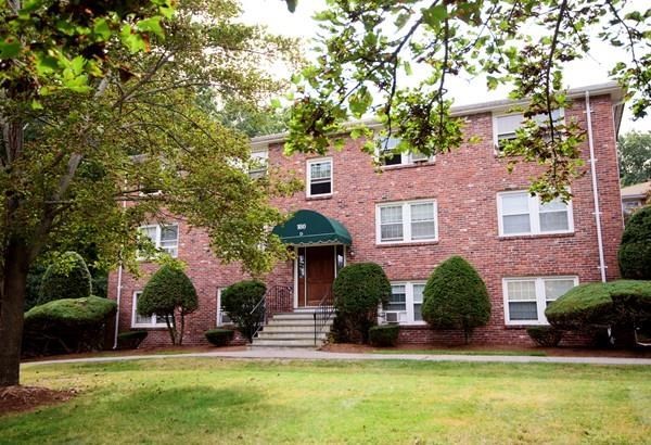 180 Tyngsboro Road, Unit 55D Chelmsford, MA 01863 - Photo 19 of 20 front view of a house with a yard