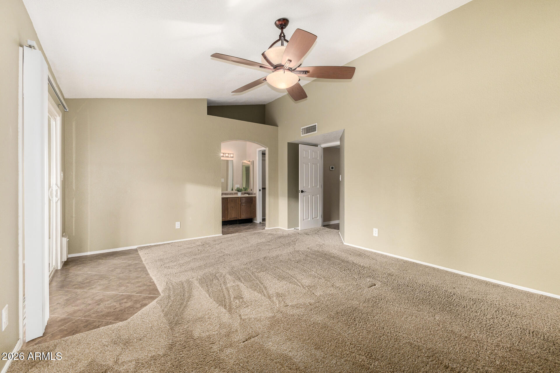 1522 N Spring Mesa, AZ 85203 - Photo 20 of 63 a view of an empty room with a ceiling fan