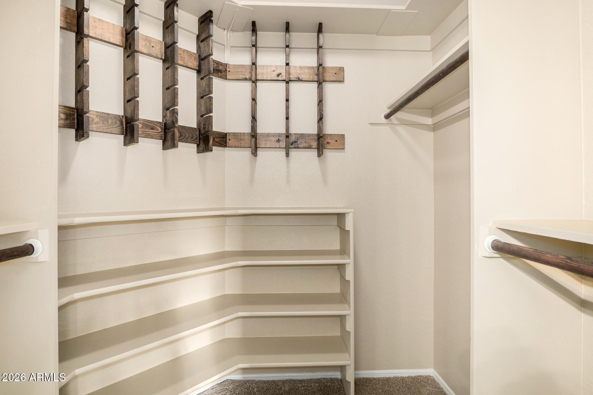 1522 N Spring Mesa, AZ 85203 - Photo 23 of 63 a view of walk in closet with empty racks