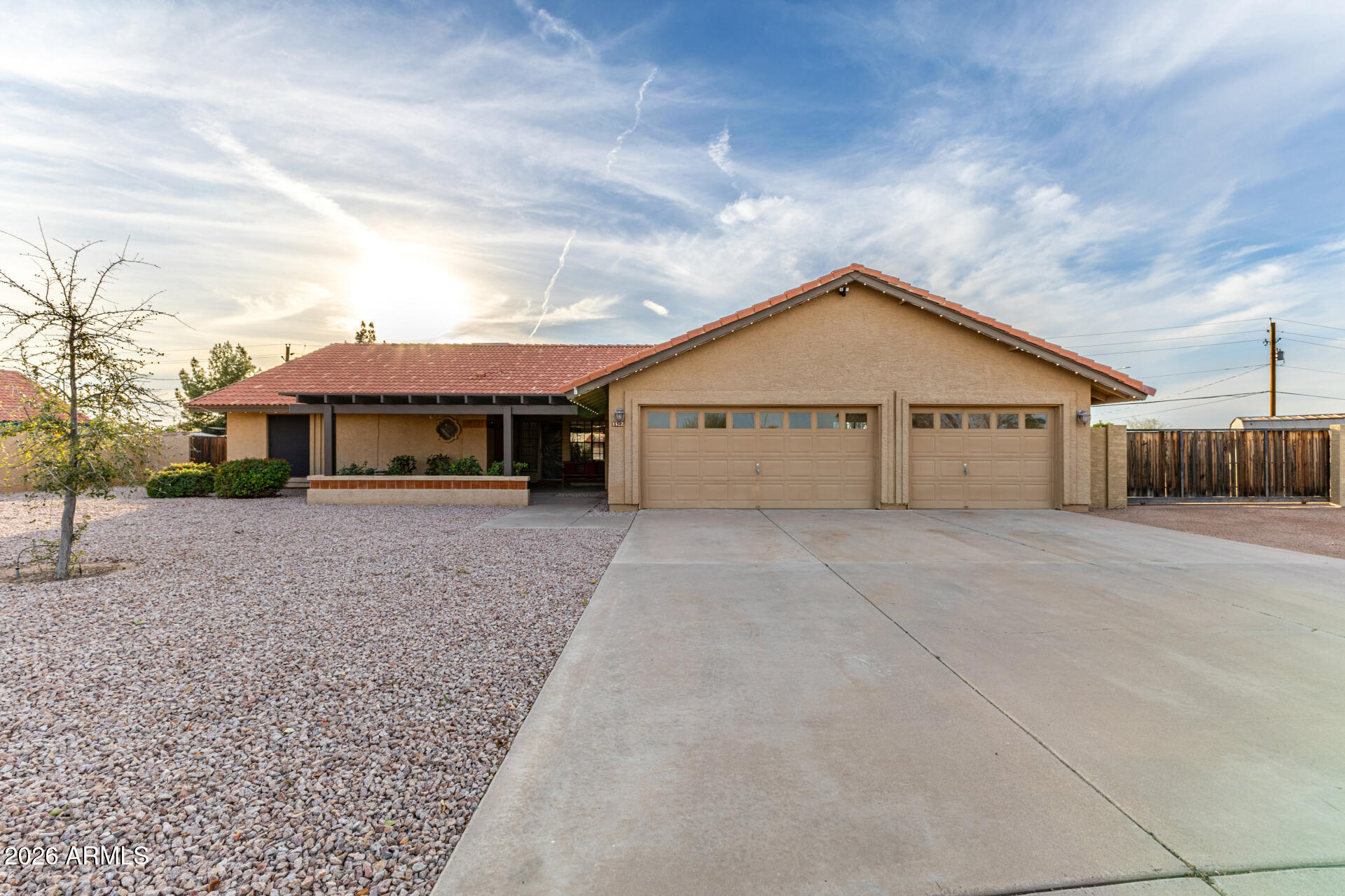 1522 N Spring Mesa, AZ 85203 - Photo 62 of 63 a front view of a house with a yard and garage