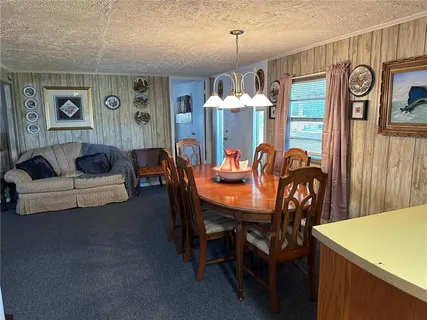 a kitchen with a refrigerator sink and cabinets