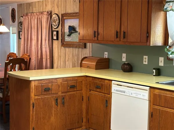 a view of a kitchen from the hallway