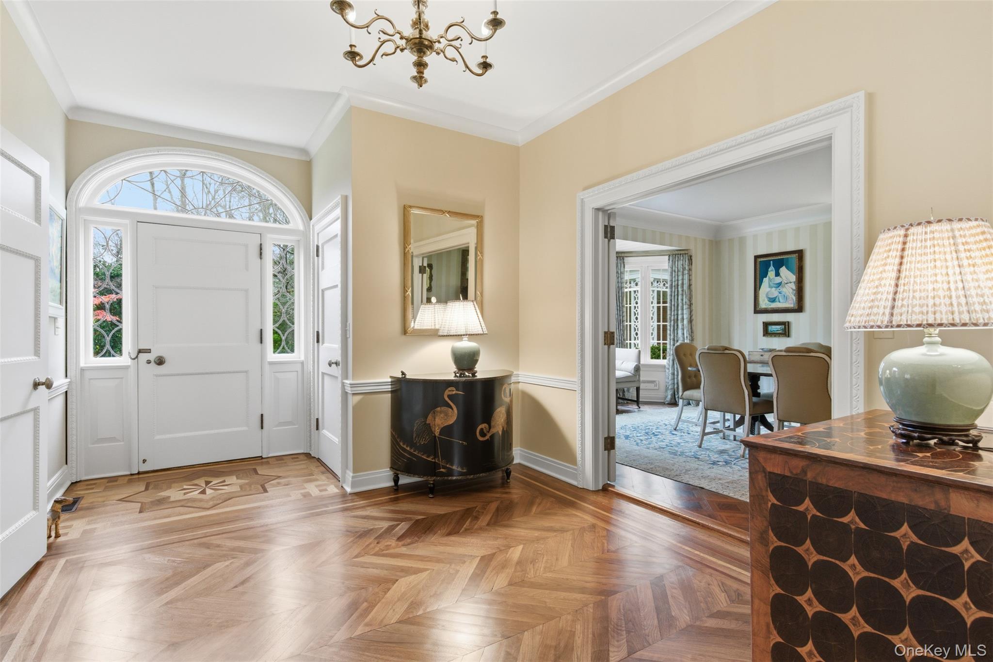 159 Factory Pond Road Mill Neck, NY 11560 - Photo 11 of 39 Foyer entrance featuring crown molding and a chandelier