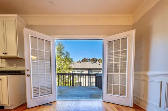 a view of front door with wooden floor