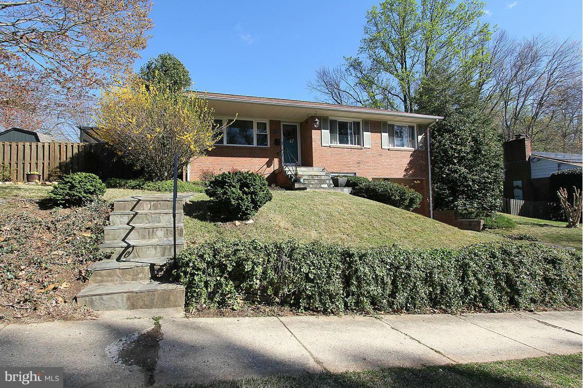109 Belton Road Silver Spring, MD 20901 - Photo 2 of 30 front view of a house with a yard