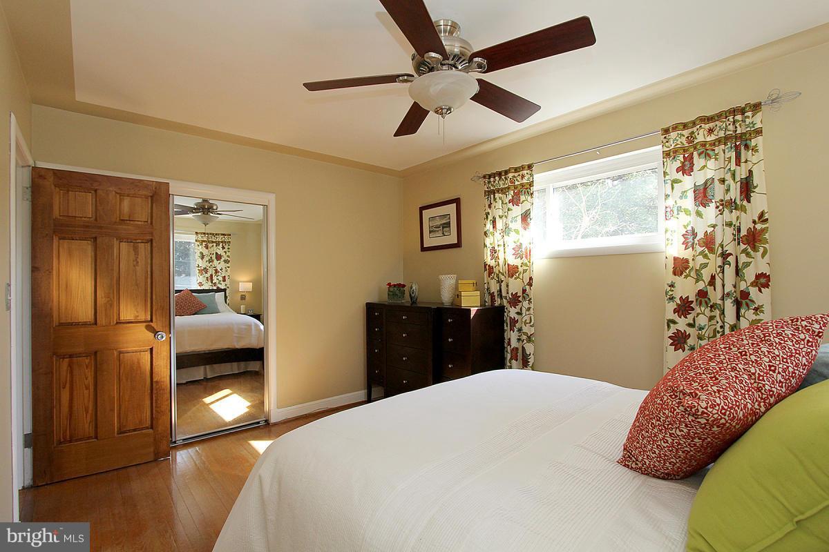109 Belton Road Silver Spring, MD 20901 - Photo 17 of 30 a bedroom with a bed and a walk in closet