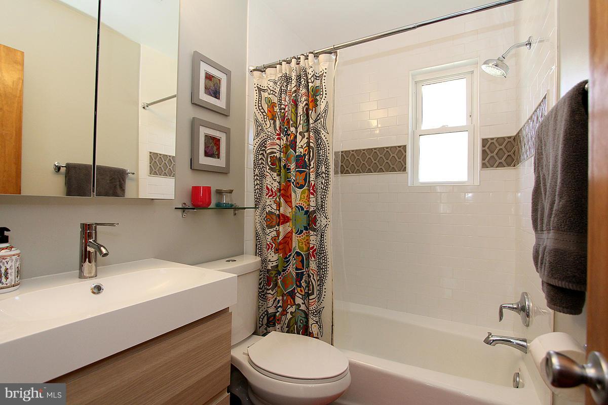 109 Belton Road Silver Spring, MD 20901 - Photo 18 of 30 a bathroom with a sink a toilet and a bathtub