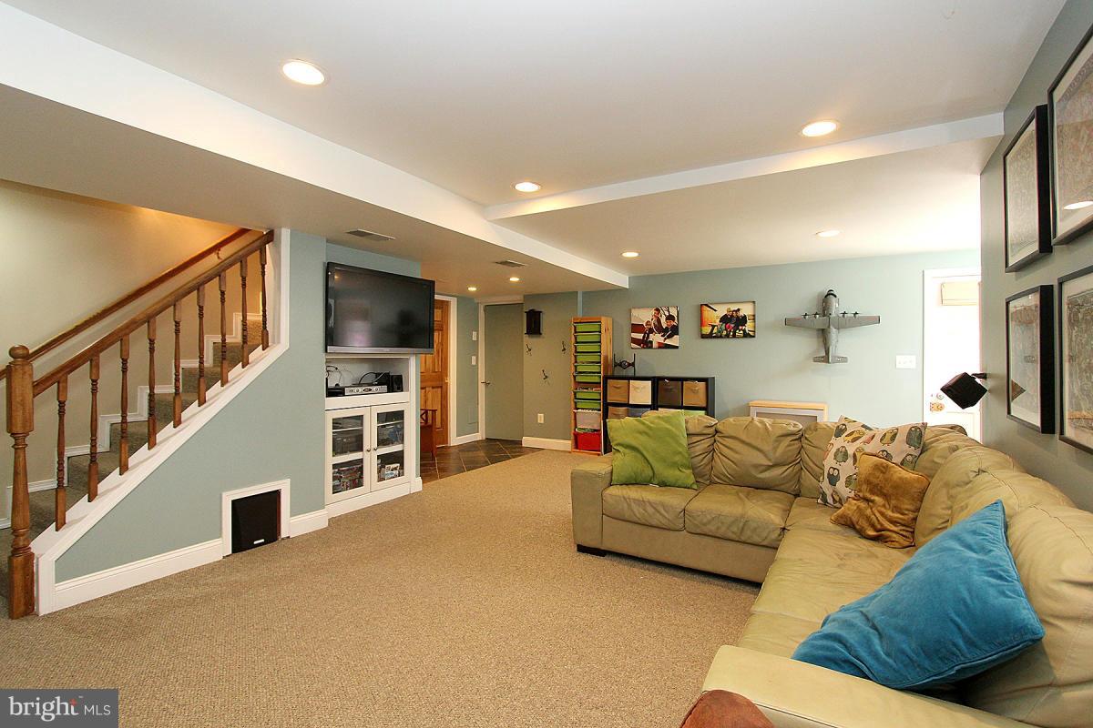 109 Belton Road Silver Spring, MD 20901 - Photo 21 of 30 a living room with furniture and a flat screen tv