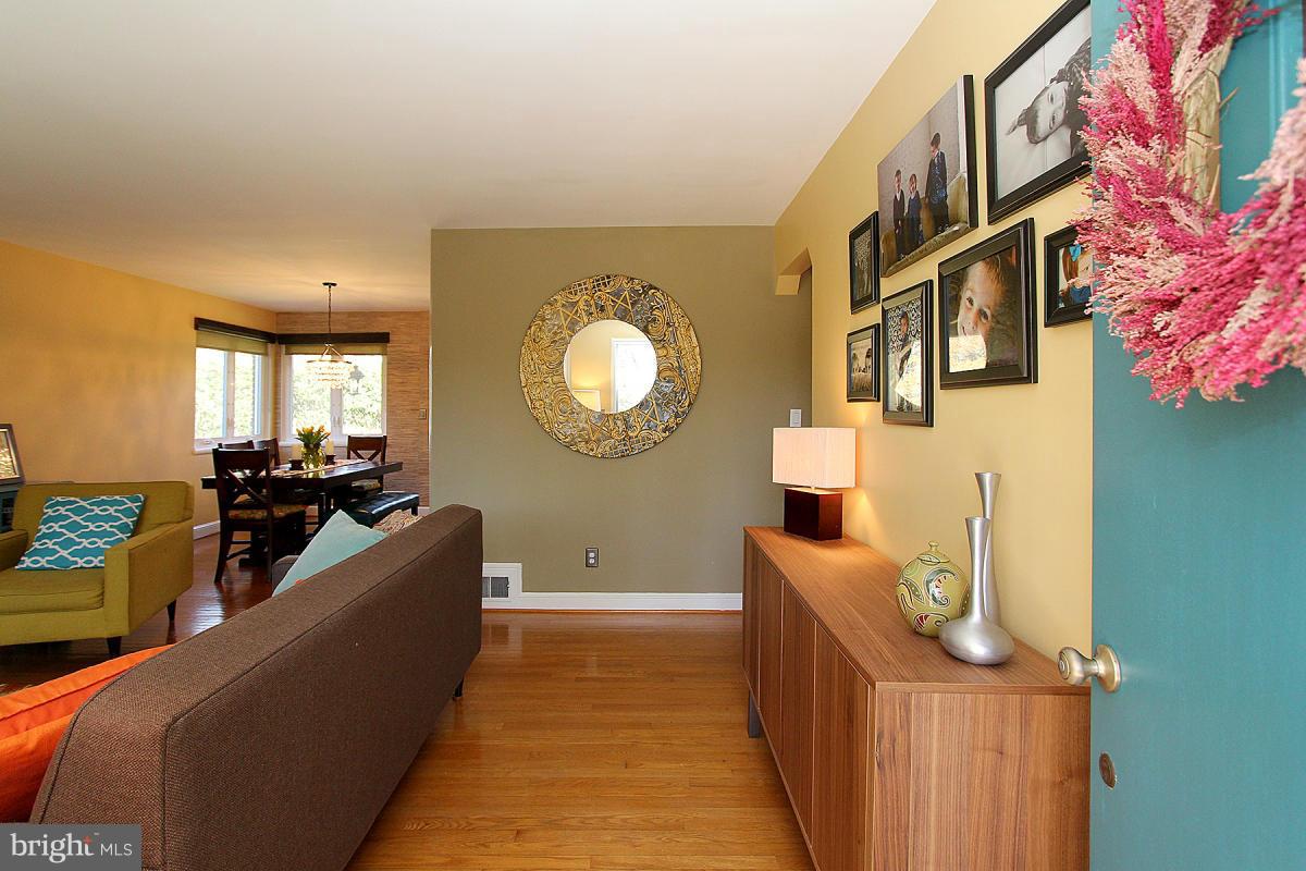 109 Belton Road Silver Spring, MD 20901 - Photo 4 of 30 a living room with furniture and a flat screen tv
