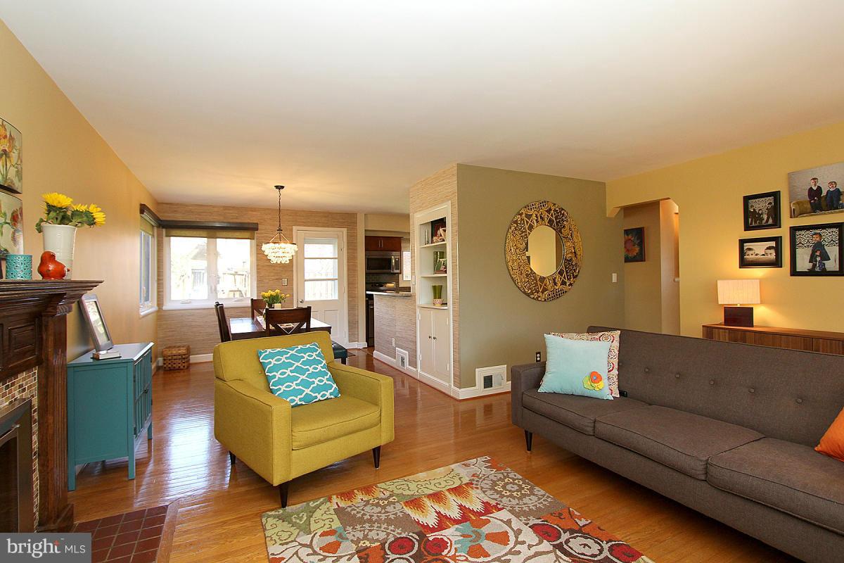 109 Belton Road Silver Spring, MD 20901 - Photo 7 of 30 a living room with furniture and a wooden floor