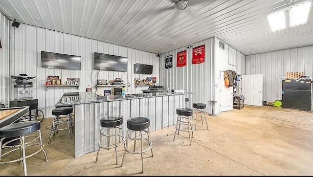 2912 Woodlawn Road Sterling, IL 61081 - Photo 21 of 48 a room with furniture a flat screen tv and kitchen view