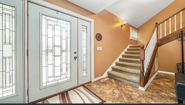 a view of an entryway with staircase