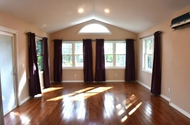 a view of entryway with wooden floor