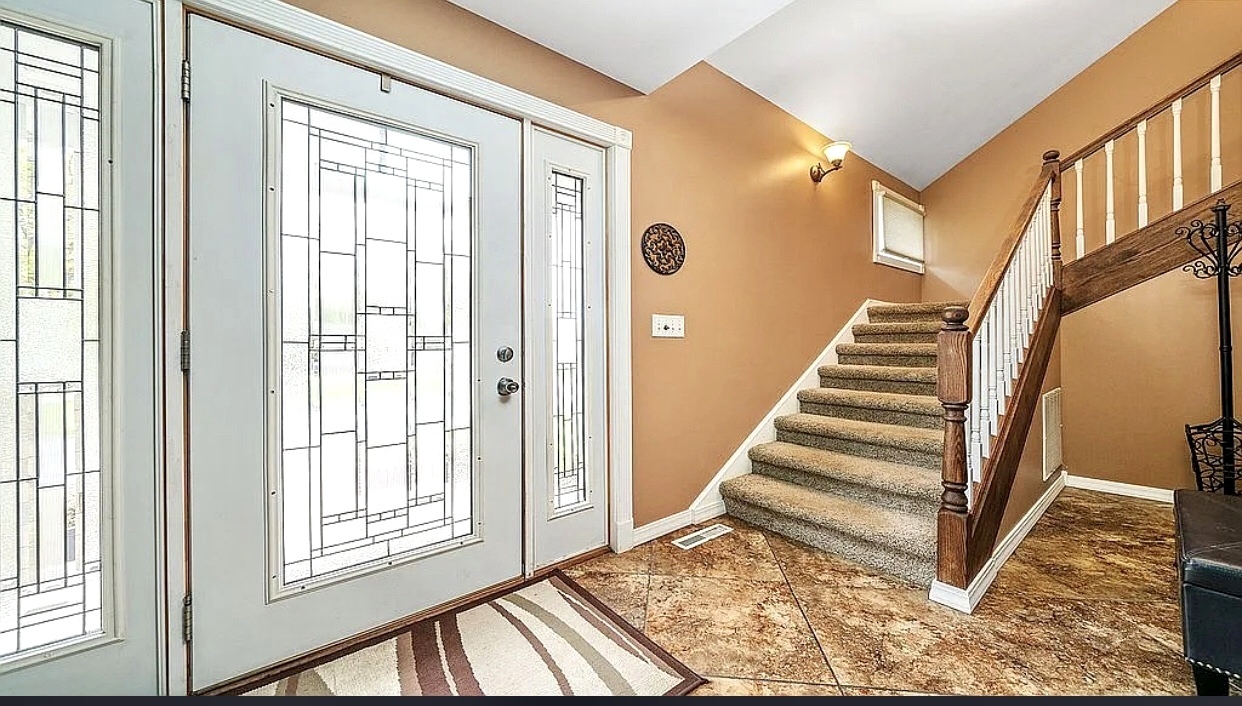 2912 Woodlawn Road Sterling, IL 61081 - Photo 25 of 48 a view of an entryway with staircase
