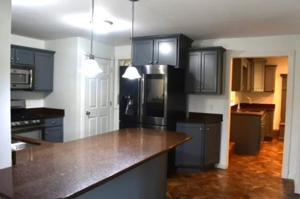 a large kitchen with cabinets