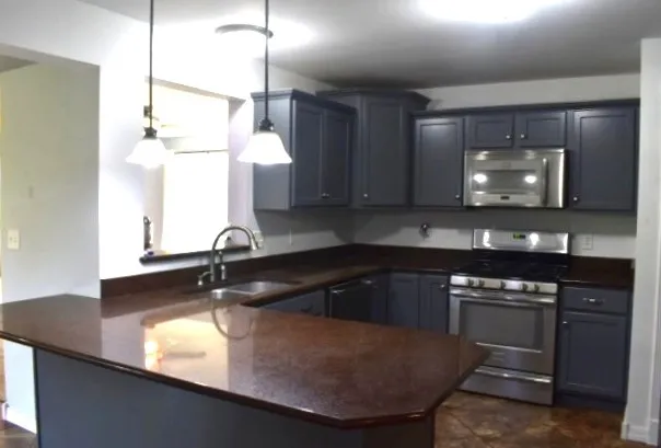 a kitchen with a sink and cabinets