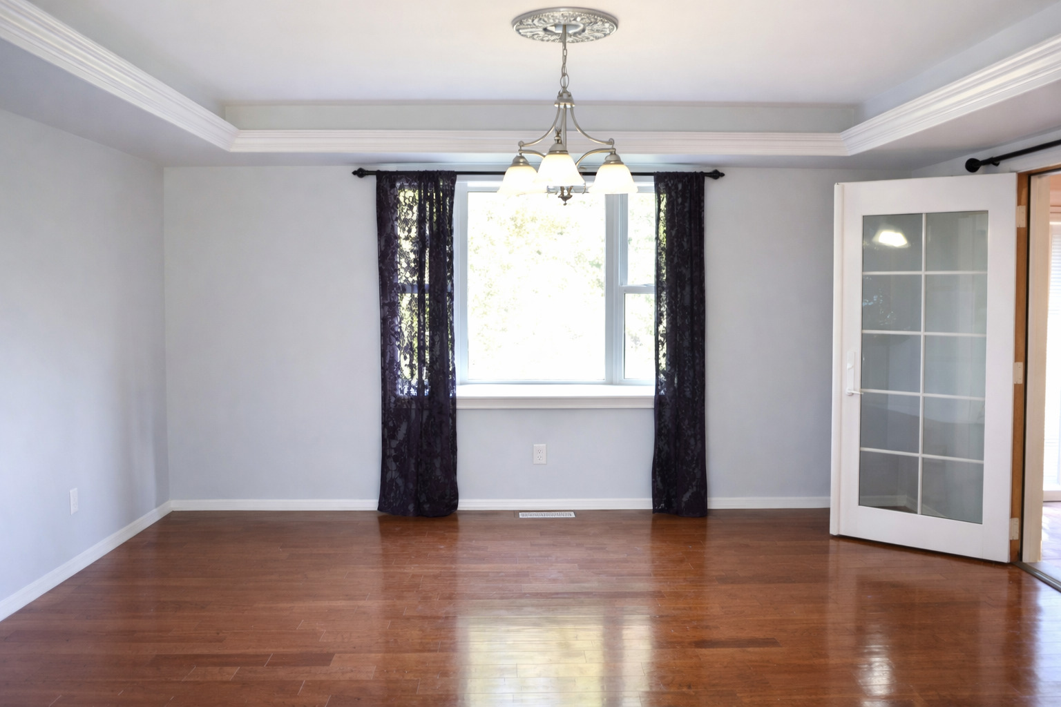 2912 Woodlawn Road Sterling, IL 61081 - Photo 29 of 48 a view of an empty room with wooden floor and a window