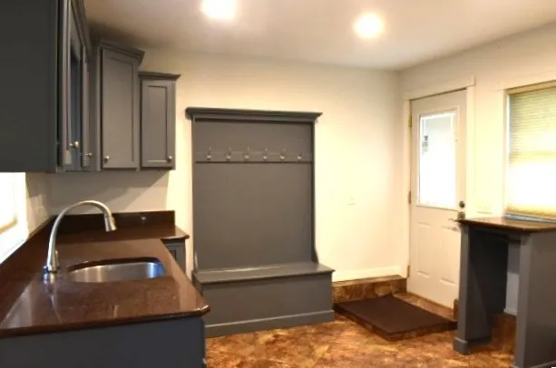 a kitchen with a sink and a refrigerator