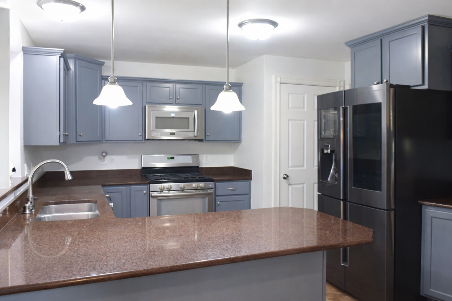 2912 Woodlawn Road Sterling, IL 61081 - Photo 32 of 48 a kitchen with stainless steel appliances granite countertop a sink a stove and a refrigerator