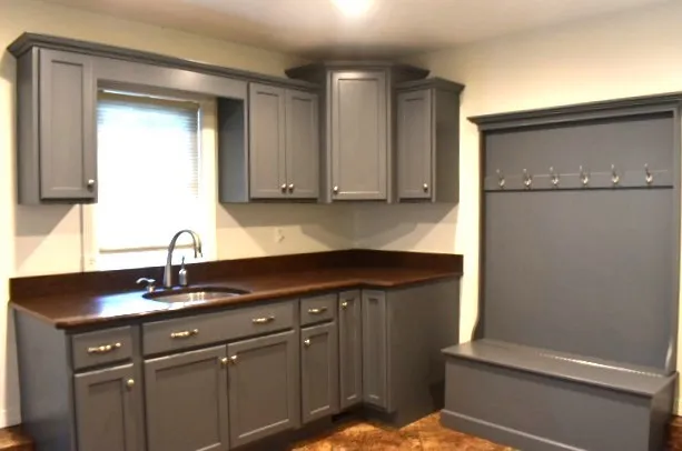 a kitchen with a sink and cabinets