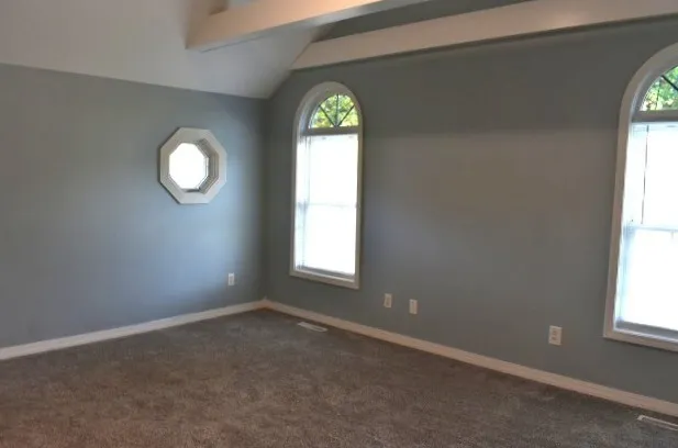 an empty room that has a window