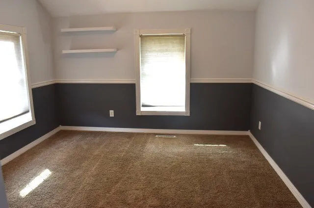 an empty room with windows